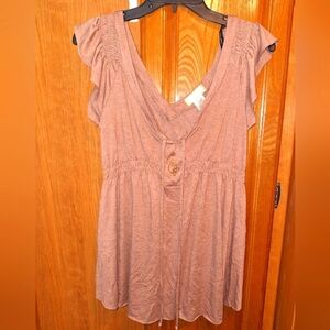 A Baby Phat ruffled sleeve double v-neck top with ties in a size medium .